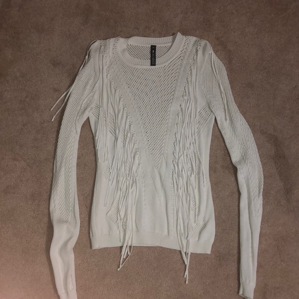 Small Design Lab white sweater with fringe in the front.